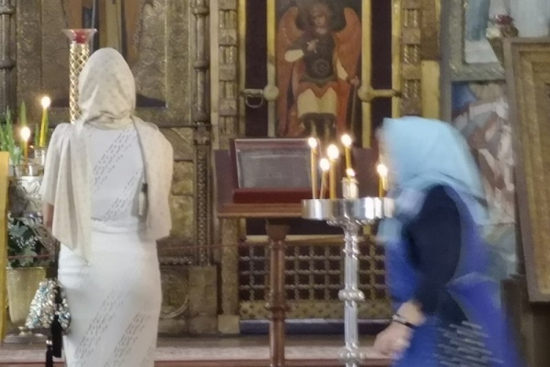 Orthodox Praying in front of Icons